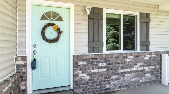 How much to replace vinyl siding with brick
